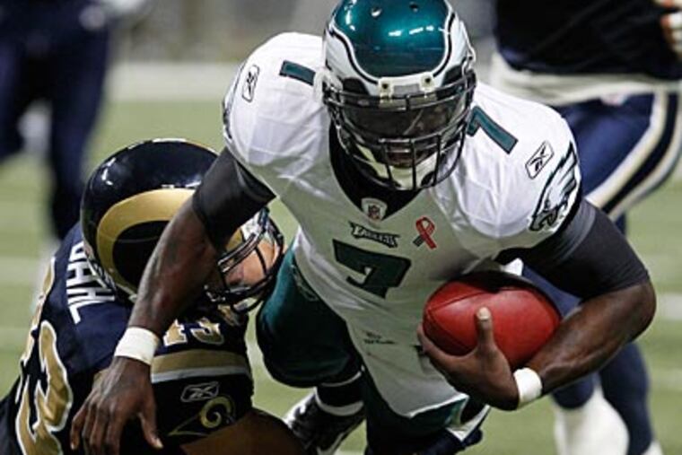 Michael Vick threw for 187 yards and two touchdowns against the Rams on Sunday. (Ron Cortes/Staff Photographer)