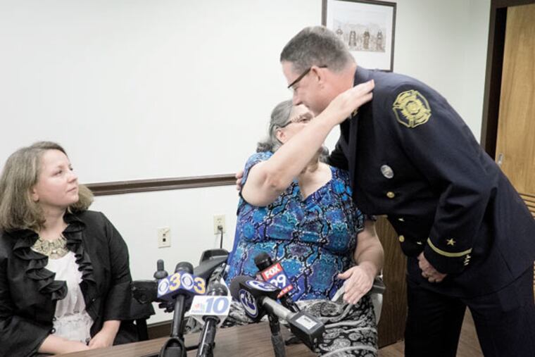 Mariya Plekan hugs John O’Neill, who rescued her two years ago after she was buried alive. (ED HILLE / Staff Photographer)