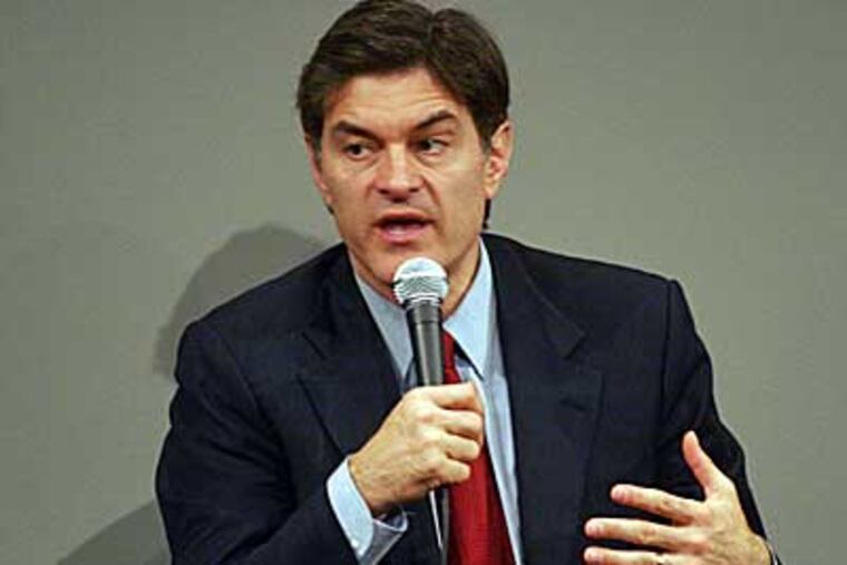Dr. Mehmet Oz takes part in a panel discussion at Donna Karan's Urban Zen Initiative Day Three, a wellness forum aimed at merging Eastern and Western medicine in order to improve patient care, in New York City. (AP Photo/Andy Kropa)