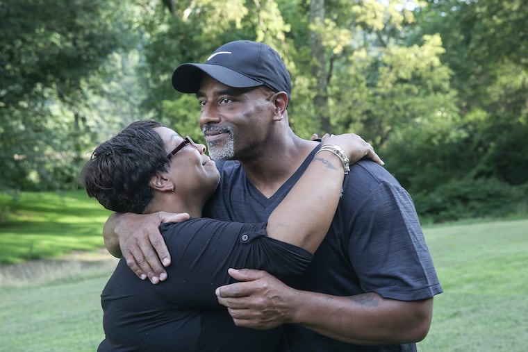 Chester Hollman III hugs his sister Deanna after he was released from the State Correctional Institution at Retreat in Hunlock Creek in 2019 after serving 28 years of a life sentence for a murder for which he was innocent.