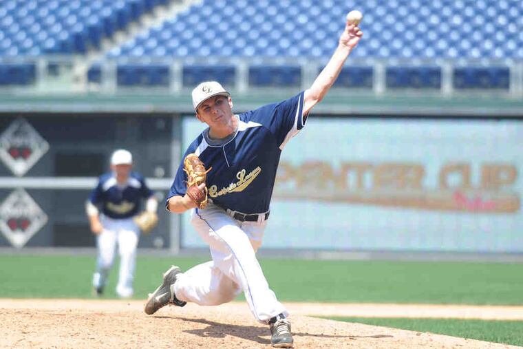 Kevin Mack delivers a pitch during his three innings of shutout relief for Catholic League team.