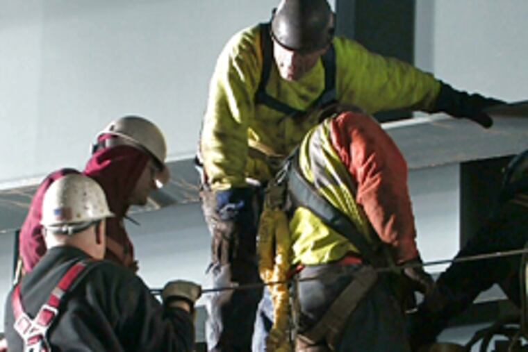 Workers scramble before dawn to get I-95 open. After completing test of temporary repairs, PennDot reopened the road about 6:20 a.m. (David Swanson/Inquirer)