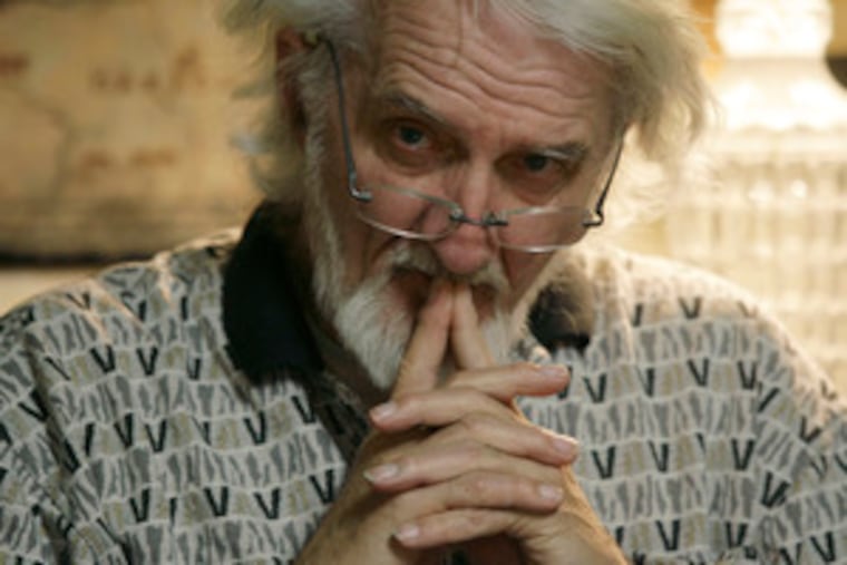 Book club founder Dick Dornisch listens to a discussion among members of the 48-year-old group. It meets every three weeks at his home.