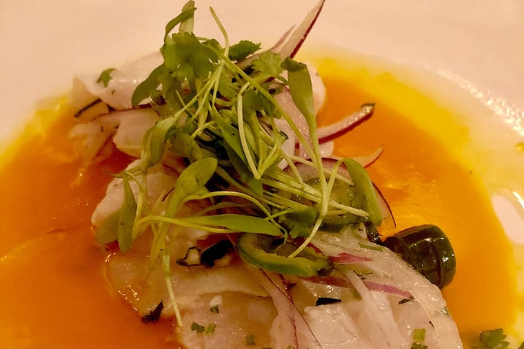 Ceviche of sea bass with a mango-passion fruit puree and serrano peppers at Nemi, Thompson and Ann Streets.