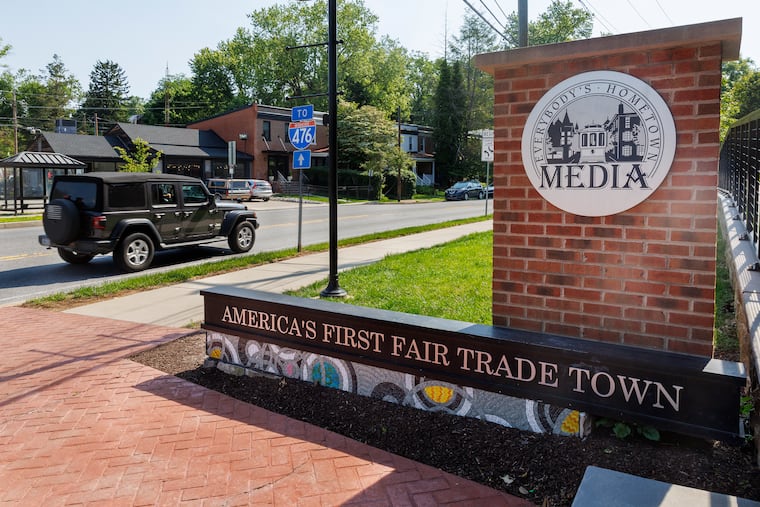 Signage that reads, "America’s First Fair Trade Town," at West State and Baltimore Avenue in Media, PA., Wednesday, June 4, 2025.