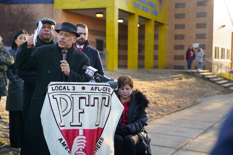 State Sen. Vincent Hughes, center; Philadelphia Federation of Teachers President Jerry Jordan, back left; State Rep. Brian Sims, back second from right; State Sen. Christine Tartaglione, back right; joined teachers and parents Wednesday in urging Gov. Tom Wolf to prioritize funding for Philadelphia's schools in this year's budget during a news conference at Carnell Elementary, another Philadelphia school recently closed due to asbestos issues.