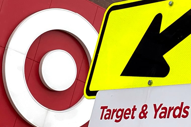 October 25, 2021: Juxtaposed signs score a bull's-eye in the shared parking lot of a national retailer and local craft brewery in Northern Liberties.