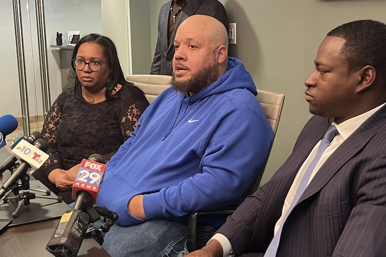 Ronald Scott speaking about his mother, Geneva Mackrides, who died after first responders allegedly weren't able to access her apartment complex on Dec. 23, 2023. He is sitting between his wife, Shahdidah Scott, and attorney Emeka Igwe.