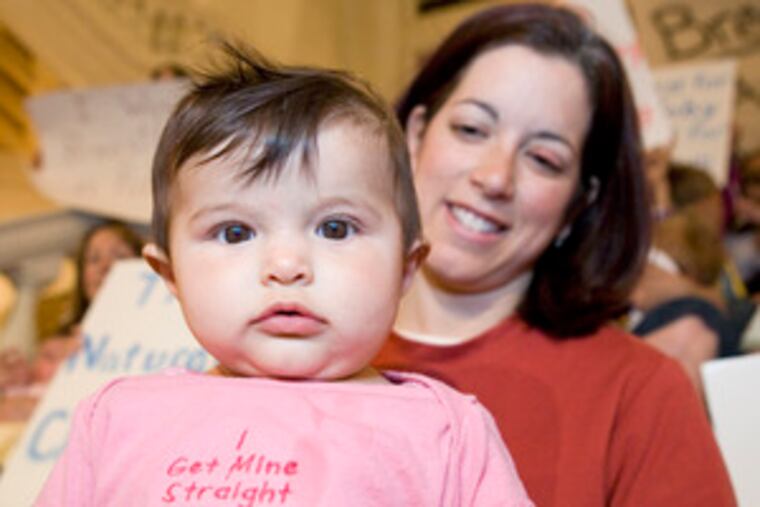 Six-month-old Maren Donahue with her mother, Suzanna , at a rally supporting bills on public breast-feeding in Harrisburg.