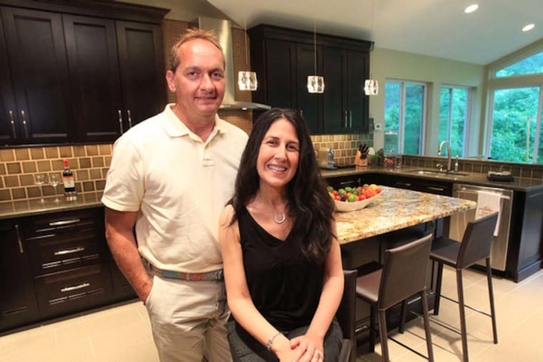 Mary Odabashian and fiance Bill DiClemente in their remodeled, expanded kitchen.