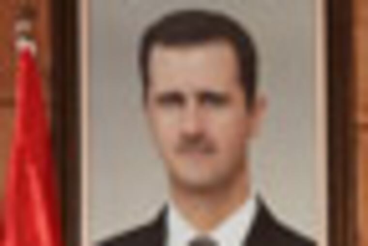 Syrian Foreign Minister Walid al-Moallem speaks at a press conference in Damascus, Syria, Monday, Dec. 19, 2011. Syria signed an Arab League initiative Monday that will allow Arab observers into the country as part of peace deal that aims to end the nation's increasingly bloody 9-month-old crisis, Syria's foreign minister said. (AP Photo/Bassem Tellawi)