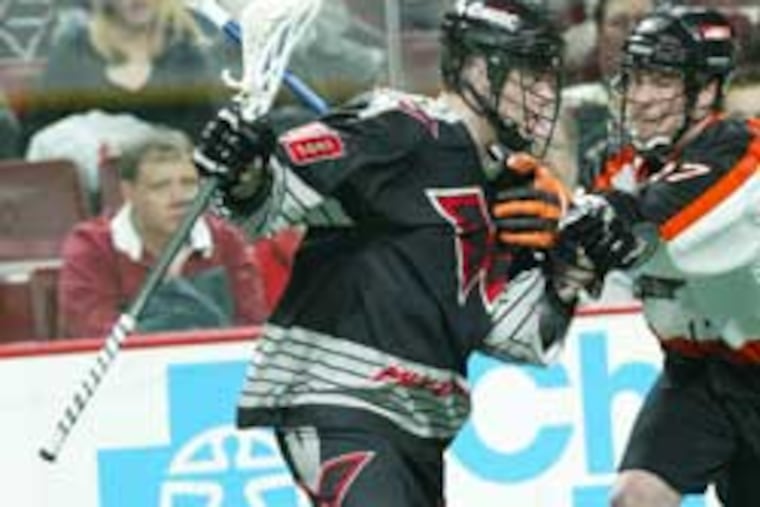 Wings forward Jeff Ratcliffe tangling with Buffalo Bandits defender Kyle Laverty. “No one wanted the season to be canceled," Ratcliffe said.