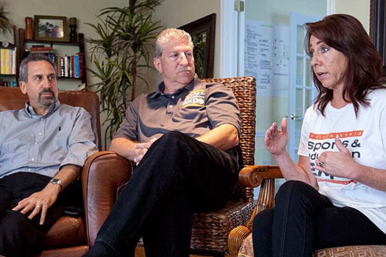 Organizers of the planned Philadelphia Sports & Education Expo (from left) Marc Rosenthal and Sherri and Perry Gold had been working for nearly two years to bring the event to fruition. (David M Warren/Staff)