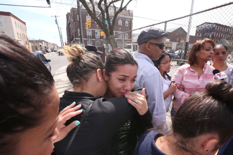 Alexis Aponte, cousin, is comforted Glorivee Diaz.The family of 2-year-old hit-and run victim who died overnight from injuries sustained Monday after being hit by a car call a press conference to demand justice and to complain about the dangereous intersection where the child and his mother were hit, Thursday April 16, 2015. (David Swanson / Staff Photographer)