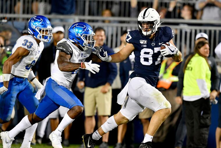 Penn State tight end Pat Freiermuth fights off Buffalo defenders for a touchdown in the third quarter on sept. 7, 2019.
