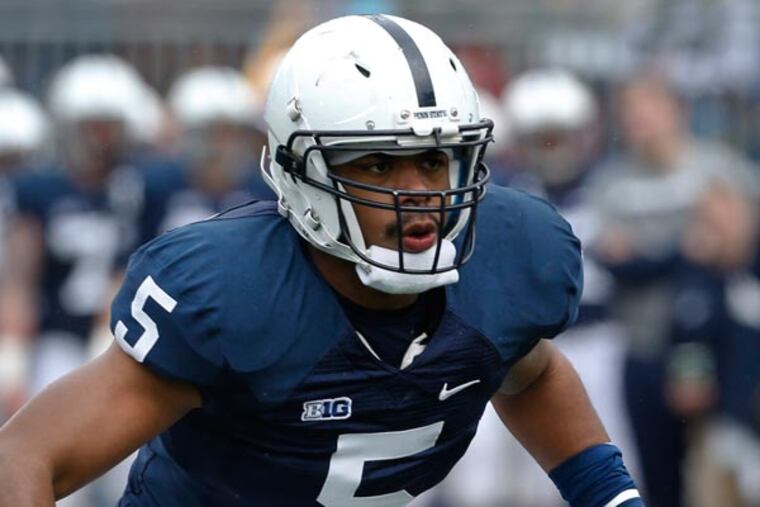 Penn State linebacker Nyeem Wartman (5) defends against Penn State running back Deron Thompson (36) in the first half of the Spring NCAA football scrimmage on Saturday, April 20, 2013 in State College, Pa. (Keith Srakocic/AP)