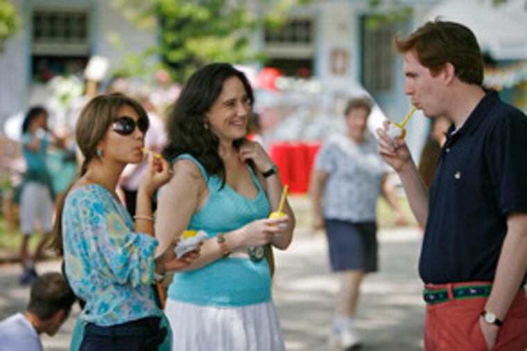 The horse show attracts, not surprisingly, a slightly different demographic from what one might encounter on a July Saturday night on the boardwalk in Wildwood. From left, Maria Hidalgo, Noelle Wister and Richard Romm enjoy sipping lemon sticks, a traditional Devon treat.