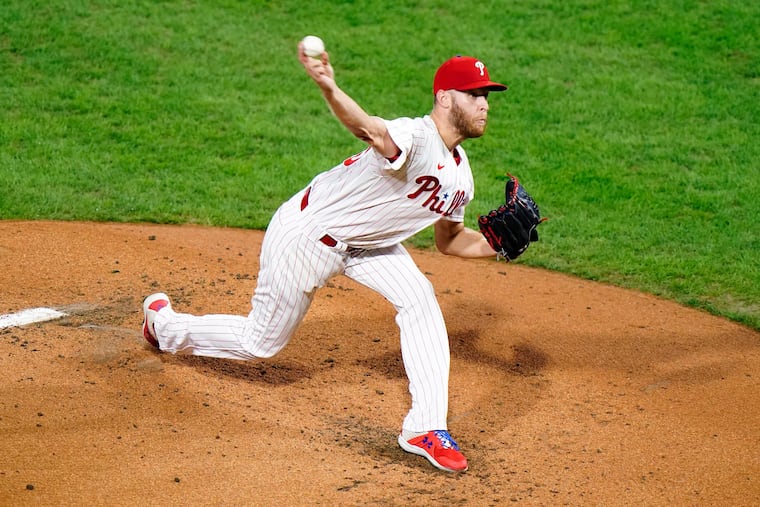 Zack Wheeler throws a pitch in the second inning against the Mets on Wednesday.
