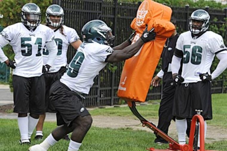 Brian Rolle, center, was probably the Eagles' most effective linebacker last season. (Clem Murray/Staff file photo)