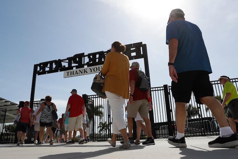 Fans leaving Thursday's spring-training game between the Phillies and Tampa Bay Rays at Charlotte Sports Park in Port Charlotte, Fla.