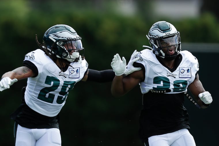 Eagles cornerback Avonte Maddox (left) works with teammate Rudy Ford during a coverage drill at practice Monday at the NovaCare Complex.