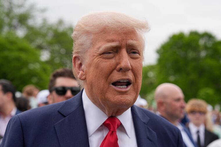 President Donald Trump speaks to reporters during the White House Easter Egg Roll on the South Lawn of the White House on Monday.