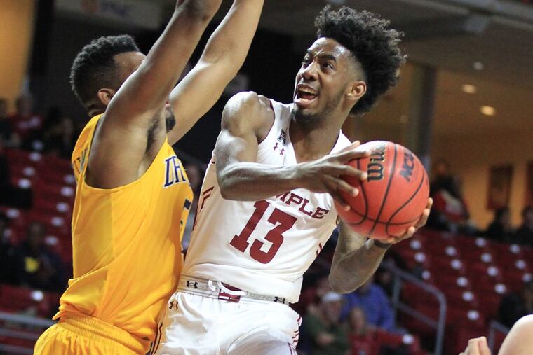 Quinton Rose, right, of Temple goes up for a shot against Drexel forward Austin Williams in the first half at the Liacouras Center on Dec. 16.