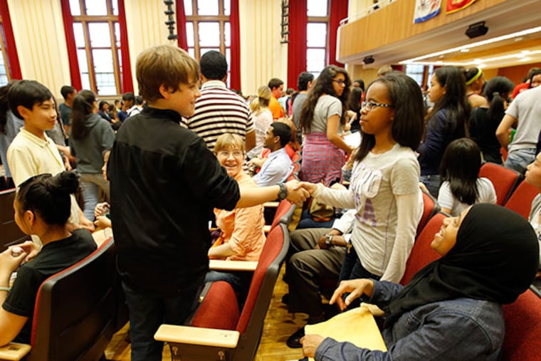 Incoming freshman Andrew Ford meets Jenaye Johnson during the Central High School class 277's freshman orientation on Thursday, May 15, 2014. ( Yong Kim / Staff Photographer )