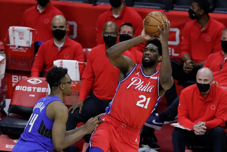 Sixers center Joel Embiid, shooting over Magic center Wendell Carter Jr. last week, is expected to play next on Sunday.