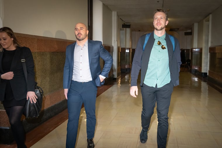 Former Eagles captain Chris Maragos (left) and former Eagles quarterback Nick Foles arrive for court at Philadelphia City Hall last February.