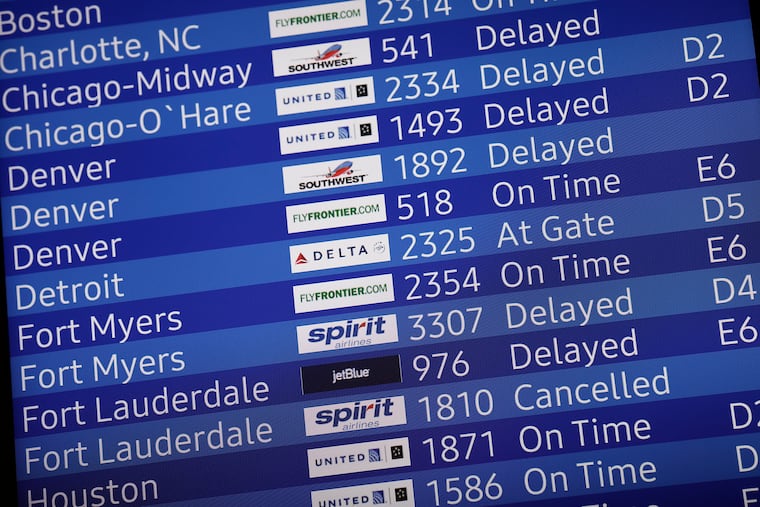 Snapshot of an arrivals screen at Philadelphia International Airport on Sunday.