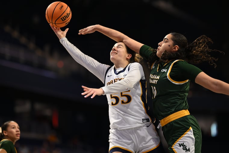 Drexel's Molly Lavin (center) is blocked by William & Mary's Jana Sallman during Saturday's game. It was that kind of day for the Dragons.
