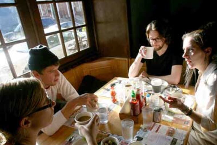 At Honey's Sit 'n Eat, left, are friends (from left) Desiree Aguno, Eric C. Deines, Robbie Bennett, and Sue Oneto. (Charles Fox / Staff Photographer)