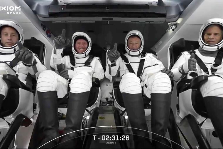 The SpaceX crew seated in the Dragon spacecraft on Friday.