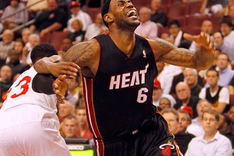 LeBron James scored 16 points and dished out seven assists in the Heat's win over the 76ers. (Yong Kim/Staff Photographer)