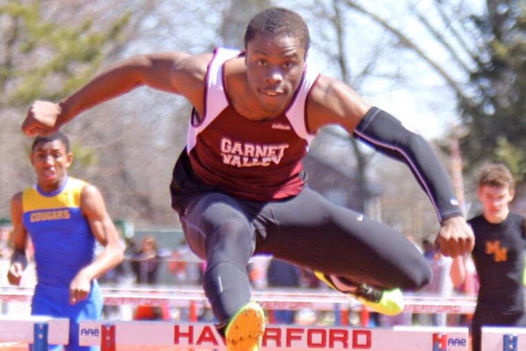 Garnet Valley senior Wellington Zaza clears the final hurdle en route
to winning the boys' 300-meter hurdles Saturday at the Haverford
Invitational track and field meet at Haverford High. Zaza won in 38.40
seconds. (Lou Rabito/Staff)