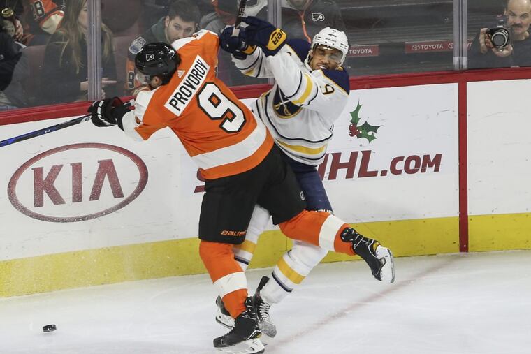 The Flyers' Ivan Provorov checks the Sabres' Evander Kane during the second period at the Wells Fargo Center.
