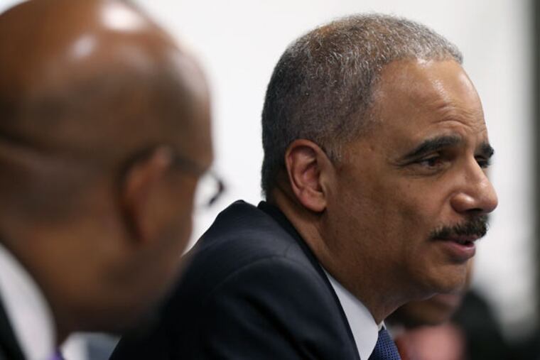 U.S. Attorney General Eric Holder participates in the Building Communities of Trust round-table discussion in Philadelphia on Jan. 15, 2015. ( DAVID MAIALETTI / Staff Photographer )