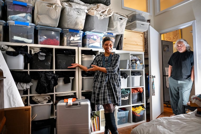 Duwenavue Santé Johnson shows the half of her closet where husband Joseph Carrillo keeps things at her Old City apartment. 