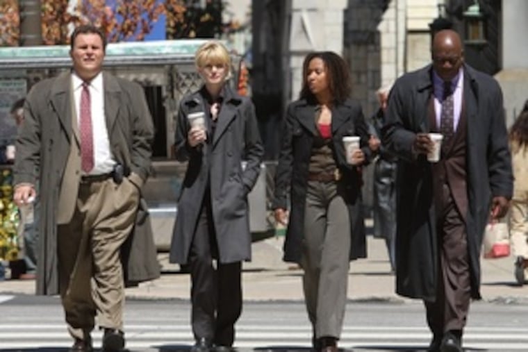 On location in Philadelphia, "Cold Case" cast members (from left) Jeremy Ratchford, Kathryn Morris, Tracie Thoms and Thom Barry rehearse a scene fromthe forthcoming episode titled "Wunderkind." The cast and crew film here twice a year to capture the city's personality and add authenticity to the series.