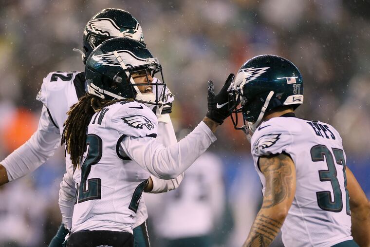 Eagles cornerback Sidney Jones (22) celebrates his fourth-quarter interception with safety Marcus Epps.