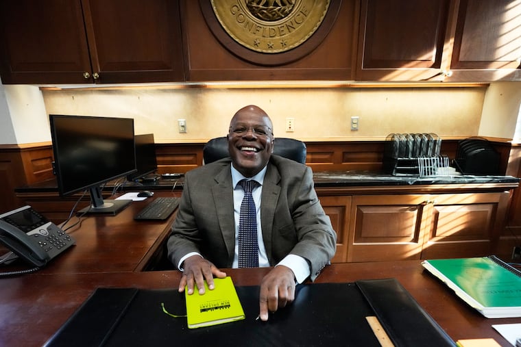 Calvin Duncan, an exoneree who was elected Orleans Parish clerk of criminal court, gets behind his desk on the first day of his term, Monday, May 4, 2026, in New Orleans. A court ruling ended his day at 9:30 a.m.