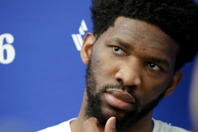 Joel Embiid talks to reporters Friday at the Sixers' practice facility in Camden.