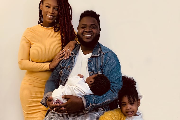 Tyanna and Marcus Myers with daughters Lyric, born at home in October, and Melody.