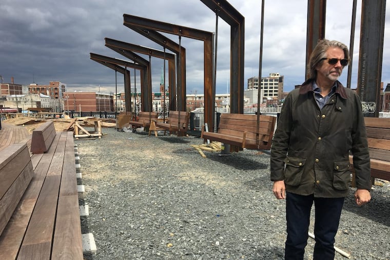 Michael Garden, vice chair of the Friends of the Rail Park, checks on the progress of the park’s first section, which begins at North Broad Street.