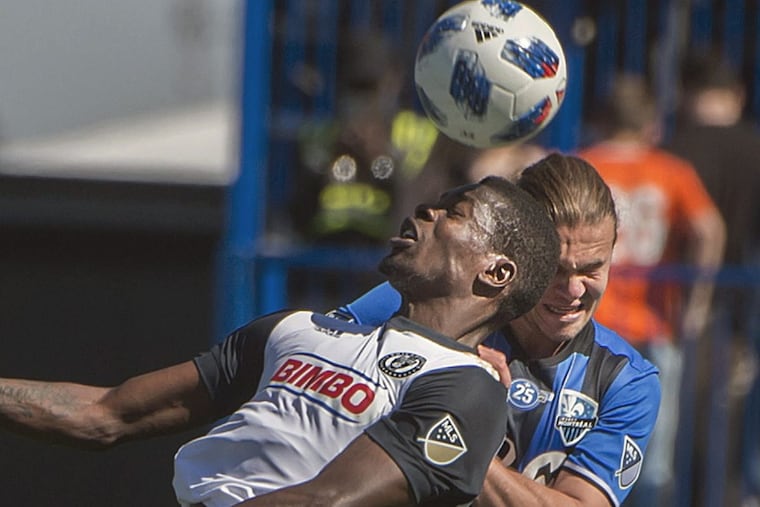 Philadelphia Union forward Cory Burke jumps to contest a ball in the air with Montreal Impact midfielder Samuel Piette.