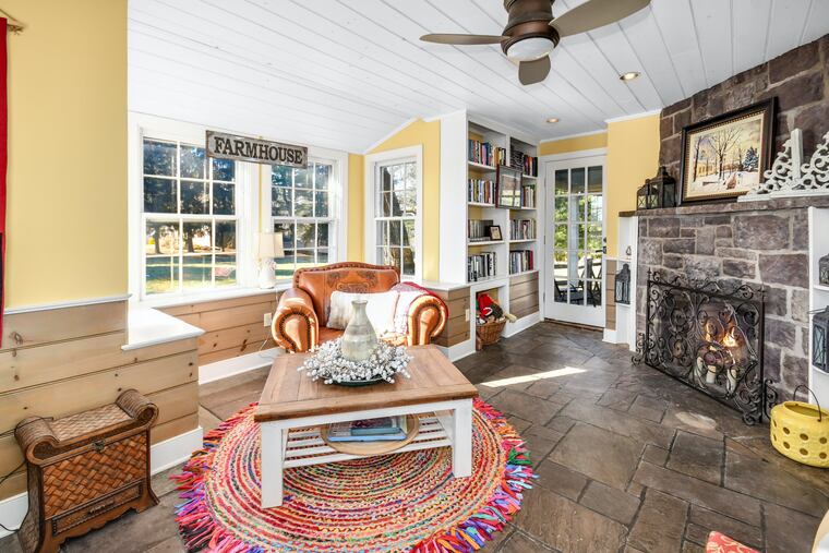 The sitting room in the farmhouse, where the walls are 18 inches thick — layered stucco and wood siding, native stone and plaster.
