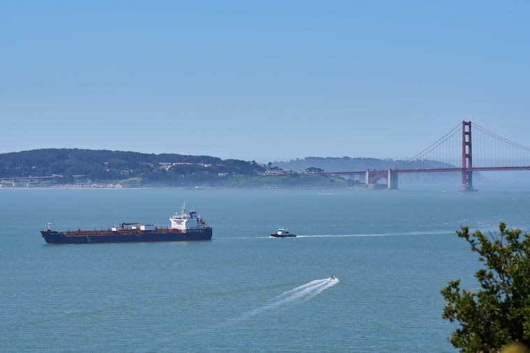 A tanker and other vessels pass through the San Francisco Bay, Tuesday, May 19, 2026.
