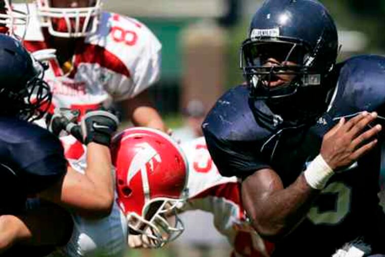 Chestnut Hill Academy's Ibraheim Campbell looks for an opening in the first quarter against North Catholic. Campbell rushed 26 times for 144 yards and two TDs.