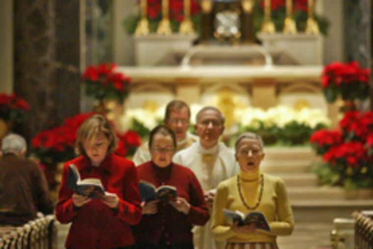 WITH CHRISTMAS Mass ended yesterday morning, the recessional begins at the Cathedral Basilica of Ss. Peter and Paul in Center City.